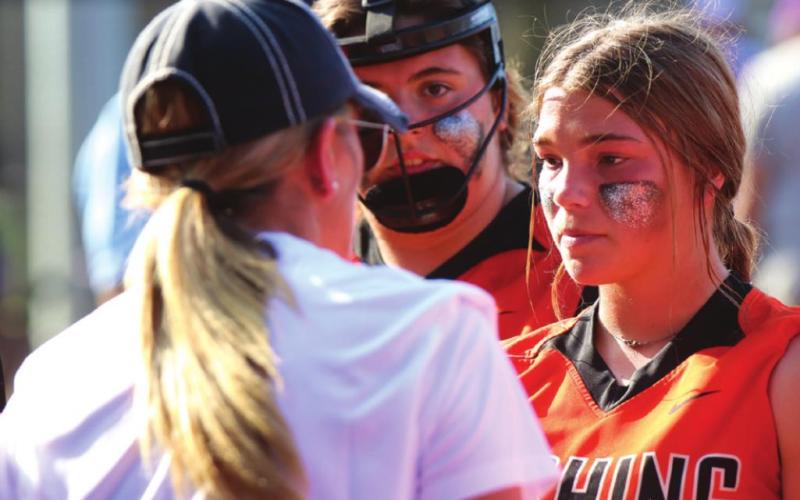 Right: Lady Tiger Head Coach Nikki York works to keep her young team focused on the task at hand.