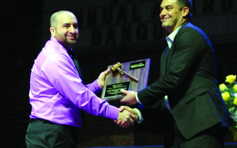 Nick Naifeh, incoming President of the Cushing Chamber of Commerce Board for Directors shakes hands with Matt Turner, outgoing president.