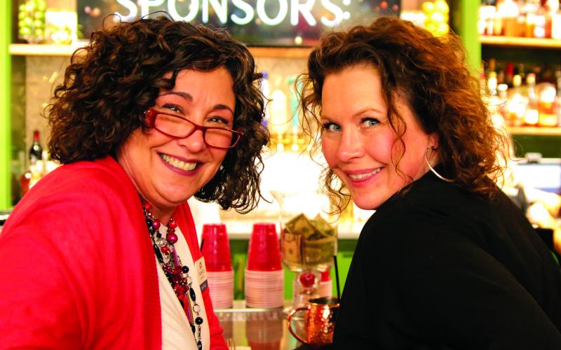 Dena Floyd and Heather Candler enjoy each other’s company on the taproom at Godofredo’s Pizzeria and Taproom during the Chamber’s annual banquet last week.