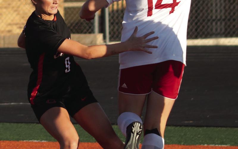 Right: Chloe Shadowen makes a steal against Ft. Gibson.