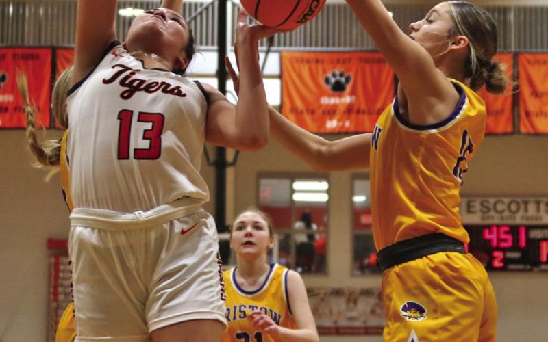 Ella Nanaeto battles for the boards against Bristow Friday. Nanaeto eight points, eight rebounds and four assists.