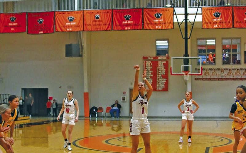 Kinsley Williams puts up a foul shot during there Lady Tigers’ 41-61 loss to Bristow. Photos by Amber Fausto