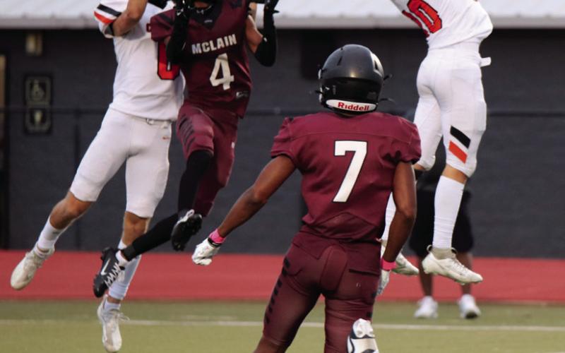 Cushing Tigers Wyatt Delong and Max Wood breakup a McClain play Thursday at McClain. The Tigers defeated the Titans 41-6.