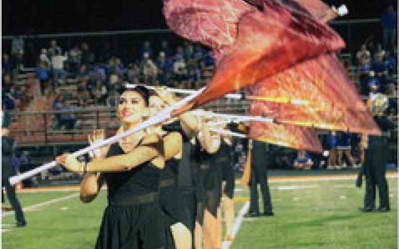 Allie Stoddard leads the CHS Tiger band color guard.