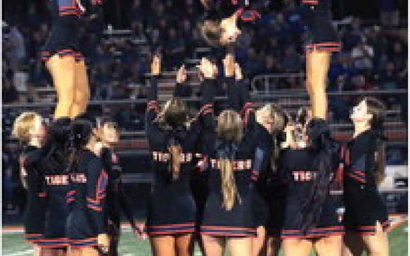 The CHS cheerleaders stunt during the halftime of the Tigers homecoming game against Miami.