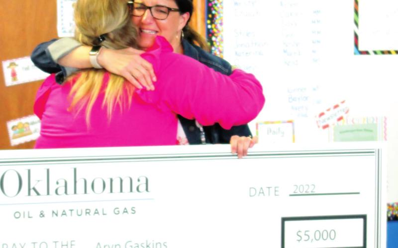 Cushing Lower Elementary teacher Aryn Gaskins hugs Jodie Shupe, the parent who nominated Gaskins for Oklahoma Energy Resources Board’s Top Ten Teachers of 2022. Gaskin’s was awarded $5,000 from Oklahoma Oil &amp;amp; Natural Gas and the district received $2,000. See story inside.