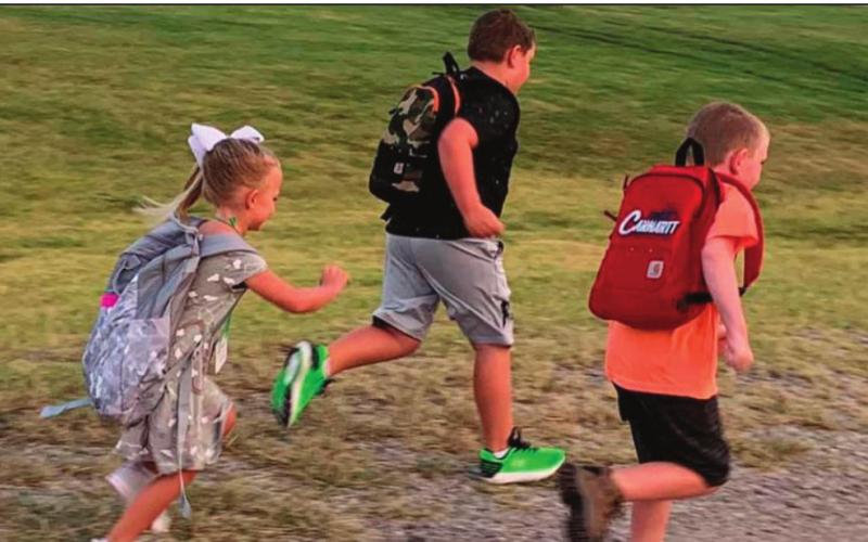 Cord Melson, 3rd grade; Wayne Melson, 1st grade and Hazel Melson, Kindergarten; couldn’t wait to get out of the house and get back to school.