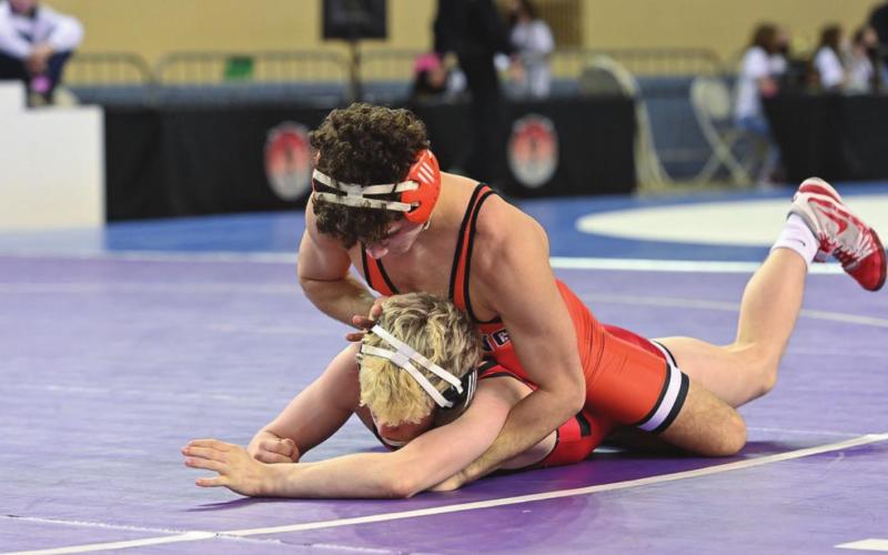 State champion Hayden Lemmons dominates his opponent.