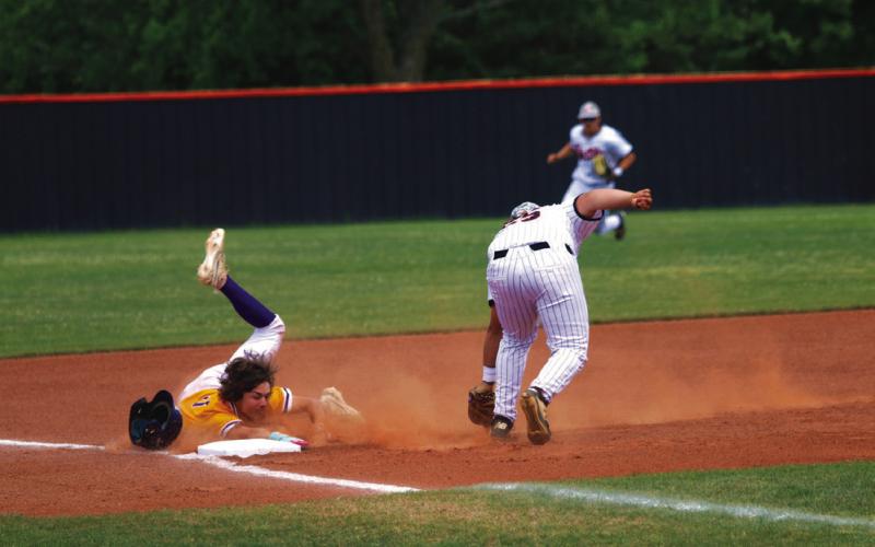 Rowdy Jackson does what he can with a Bristow base runner and a late throw at third base. Photo by Allie Prater