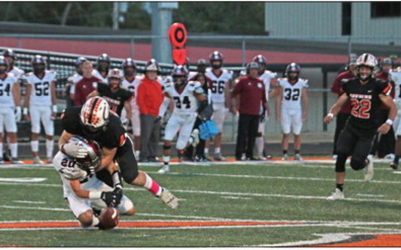 Cushing Linebacker Riley Matheson makes one of his 21 tackles as he brings down Wagoner senior quarterback Gabe Rodriguez.