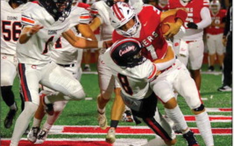 Jordan Kersey tackles a Ft. Gibson runner. Photo by Sylvia Danyele