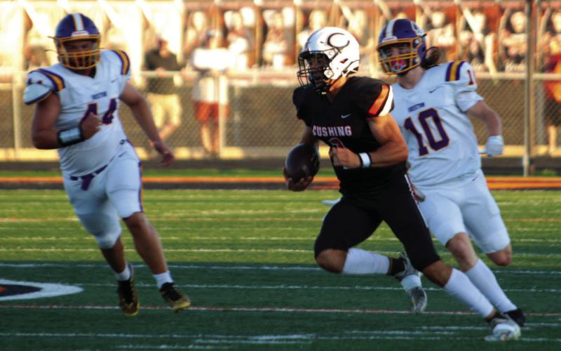 Blaze Berlowitz shows his versatility as he scrambles out of the pocket and runs to a first down Friday.