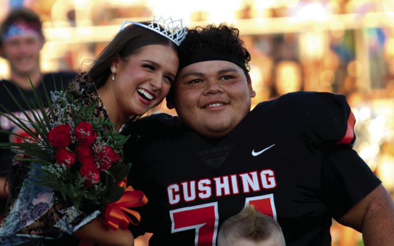 Cushing Homecoming Queen Georgia Griffeth and King Nicholas “Panda” Flores enjoy their moment during homecoming festivities held Friday, prior to the Tiger’s route of Berryhill, at O’Dell Field. Photo by J. D. Meisner