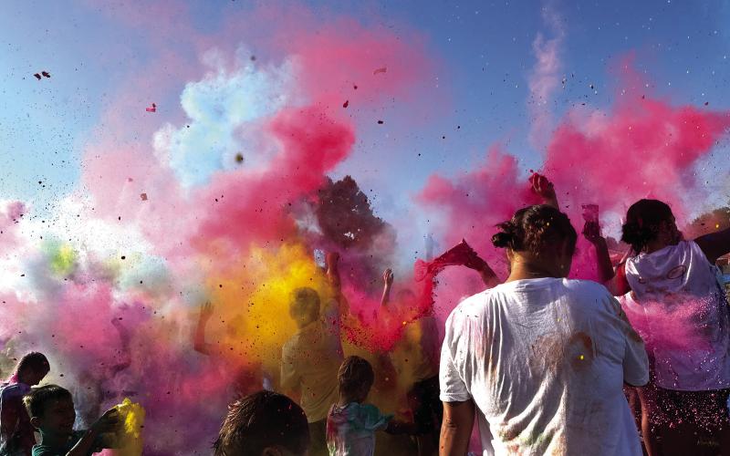 Participants in the 2025 Do or Dye color run hosted by the Cushing Geographic Club throw powder for the color explosion following the 5k Saturday, Aug. 16 at Memorial Park. See more photos on page 10. Photo by Allie Prater.