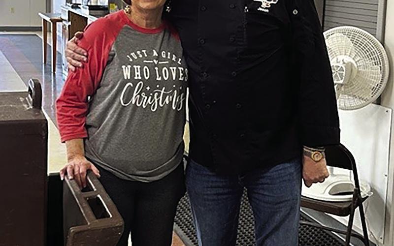 Debbie Brown, director of the Senior Citizen Center, stands with Jason Kinsey of Steer Inn Cushing after Kinsey donated and delivered a Christmas feast for local seniors. The meal included barbecue pulled pork, mashed potatoes and gravy, green beans, rolls and apple cobbler, serving 81 seniors at the center and providing 30 meals to homebound residents.