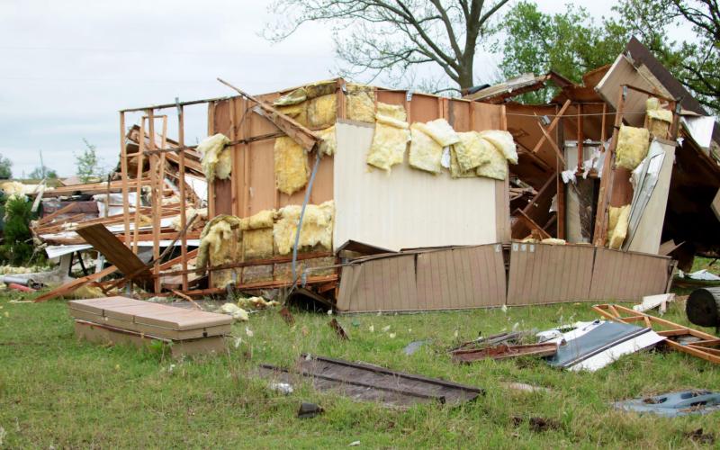 Scrap wood and insulation is all that remains of a vacant mobile home on Kimberly and Jeff Willson’s property near Ripley after a strong F1 tornado touched down Monday. Photo by J. D. Meisner