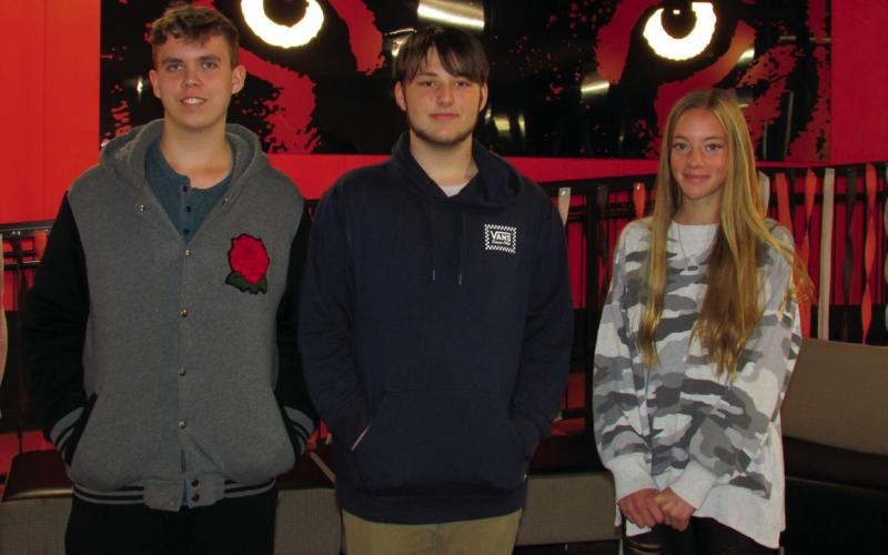 Cushing High School students — Austin Randall, Keegan Houtchins, and Emory Eyler all had art selected to be part of a performance celebration in honor of John Williams following a statewide contest in which only 12 artworks were chosen.