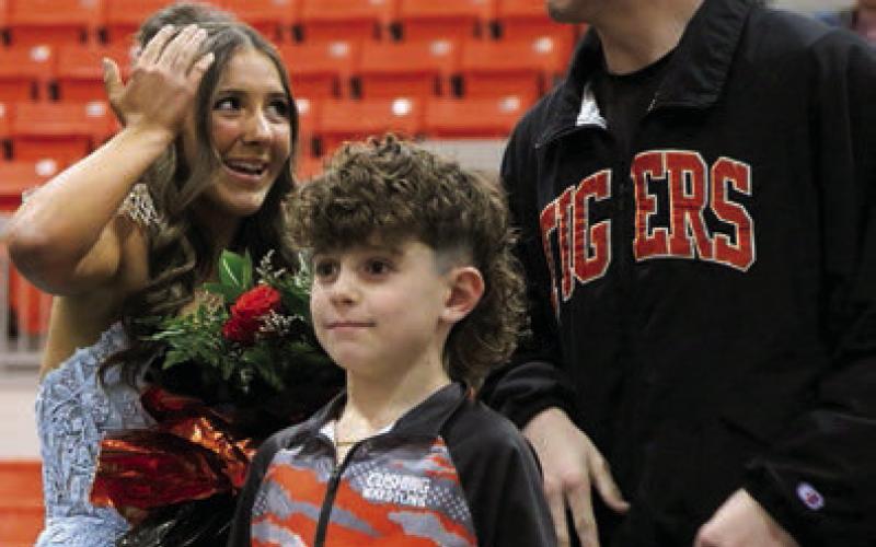 Whoops! Royal protocol took a brief tumble as the Homecoming Queen, Laramie McCoy’s crown slipped mid-moment, prompting priceless reactions from both King Bryce Ward and the queen. Photo by Allie Prater