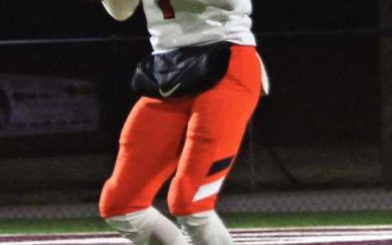 Blaze Berlowitz under the lights in Blanchard Friday. He threw for 180 yards and two touchdowns against the Lions.