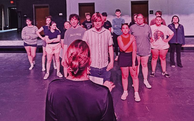 Emily Moore offers direction to cast members of the upcoming performance of “Footloose” the musical during a recent rehearsal to prepare for the spring production.