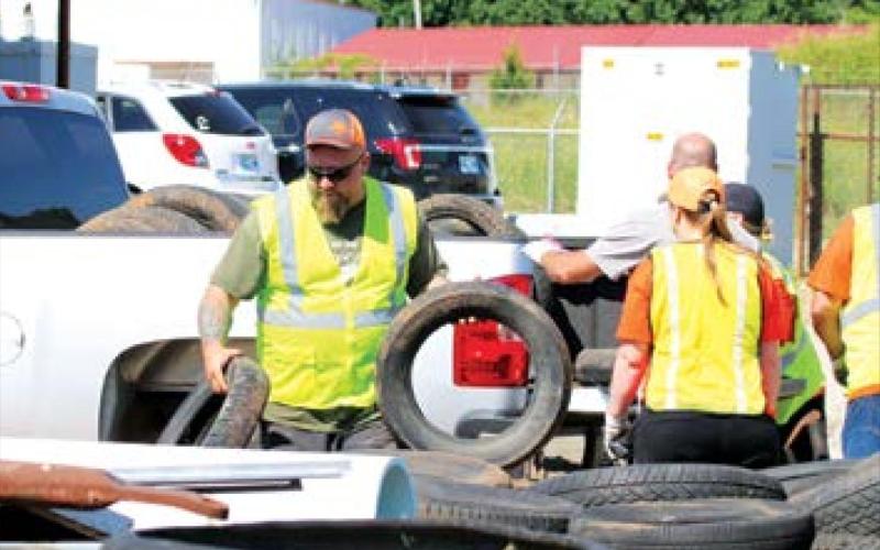 Cushing City Emplopyee Jeremy Brown unloaded tires at the city yard.