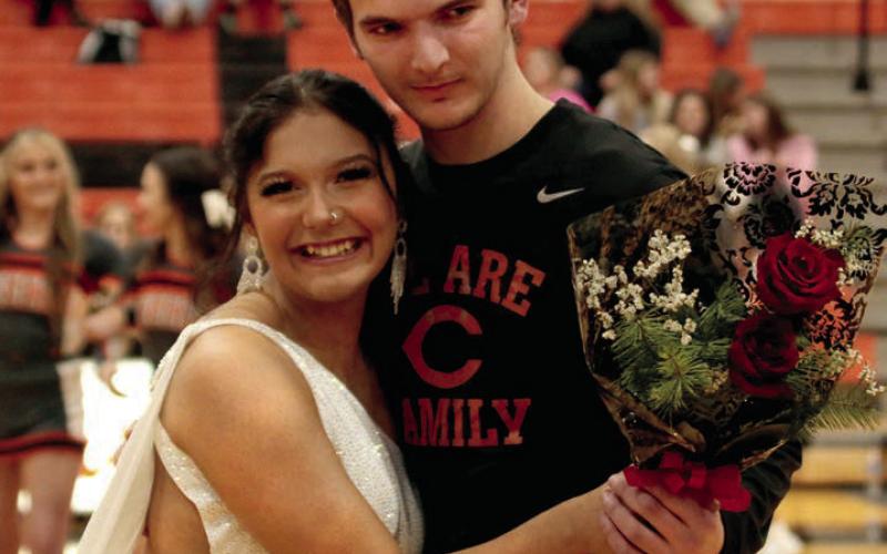 Logan Spradlin escorts Thea Robbins.