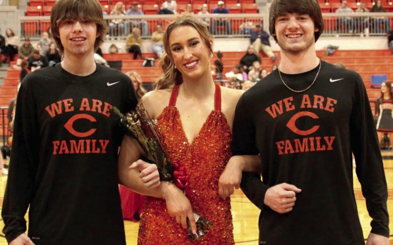 Topher Blevins and Matthew Grossenheider escort Karley Clemons.