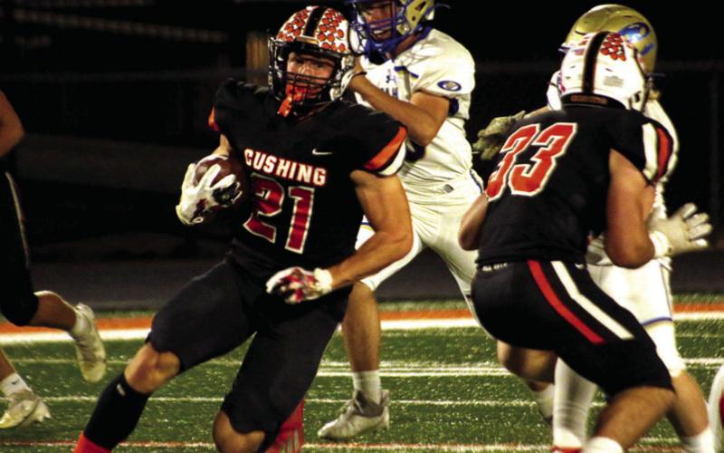Camden Crooks carries the ball during Thursday’s beatdown of Oologah.