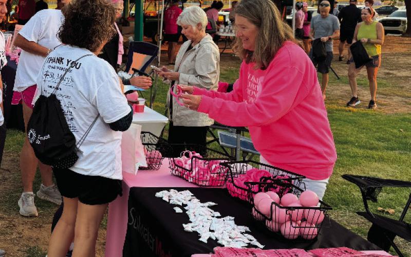 Pictured at the Enid breast cancer awareness event, Shyla Eggers promotes Stillwater Medical Center. After years of helping share patient stories, Eggers recently found herself navigating her own health journey with sleep apnea.