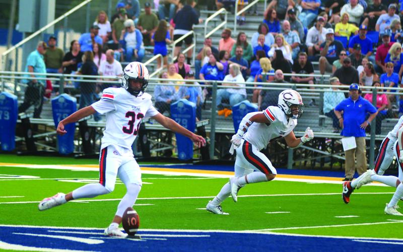 Landon Miller kicks off Cushing’s 2025 football season. The Tigers traveled to Berryhill Friday and eked out a 24-23 win. Story inside. Photo by Sylvia Danyele