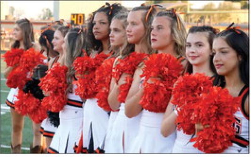 The Tiger spirit squad listens to the National Anthem. Photo by Sylvia Danyele