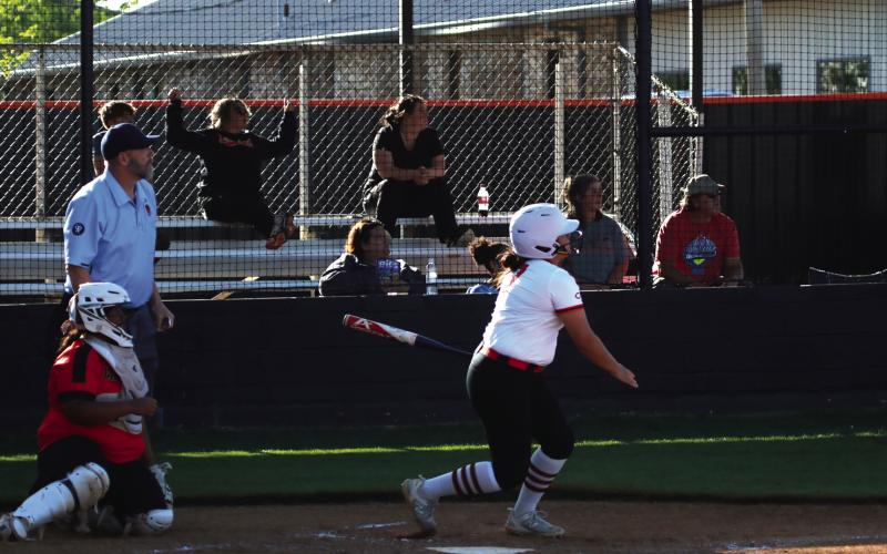 Everybody watches Ava Hebensberger’s solo home run gain altitude. Where did it go? Read the story on page 5 to find out. Photo by J. D. Meisner