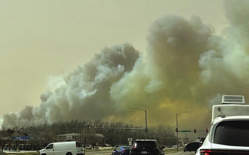 Wildfires burn thousands of acres, dozens of homes