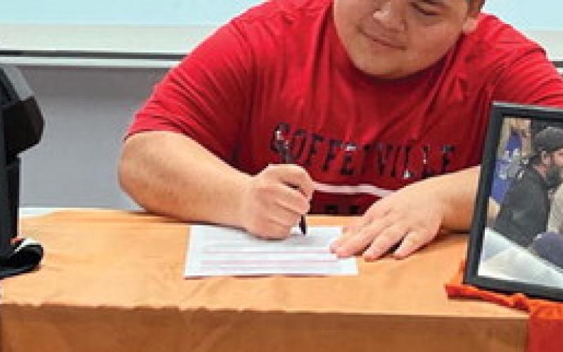 Nic “Panda” Flores signs his letter of commitment to continue his powerlifting and academic career at Coffeyville Community College in Coffeyville, Kansas.