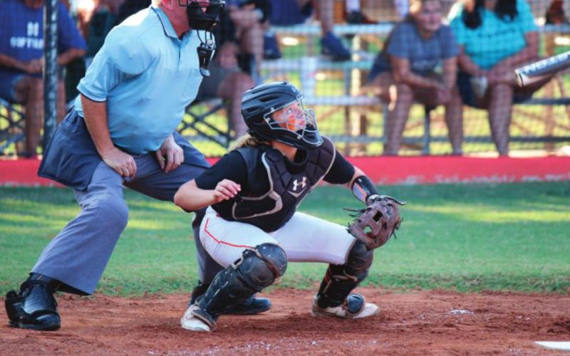Madi Alexander spots a fly ball from behind the plate.