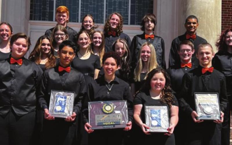 Cushing choir students stand on the steps of Oklahoma Baptist University holding the accolades they earned at the OSSAA State Choir Contest including the Sweepstakes Accent Awards.