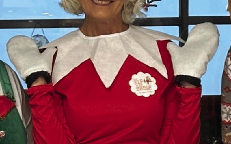 Always willing to be silly to make kids smile Nancy Dowell dressed up as an elf during the holidays in recent years at the school.