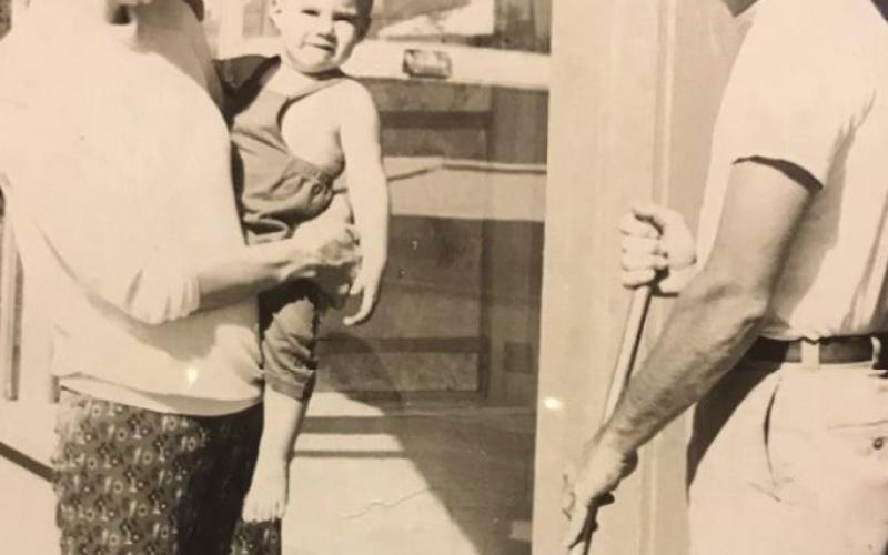Gary remodeling his first Cushing Clinic (on North Little) in 1974 as Roz, Geoff and future daughter Heather look on.