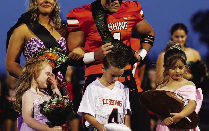 Queen Gracyn Presley and King Kellen Fry stand with flower girls Montana Ivy Cloud and Lylah Beasley and crown bearer Bowen Loftis.