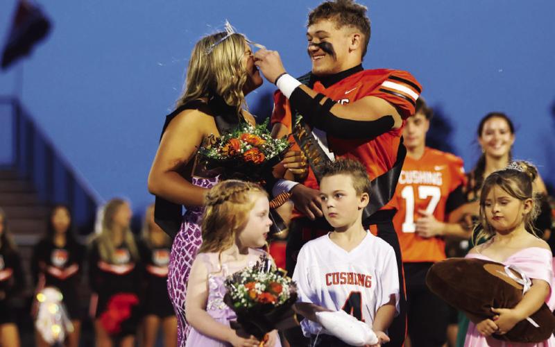 Kellen Fry wipes residual eye-black off of Gracyn Presley’s nose postkiss.