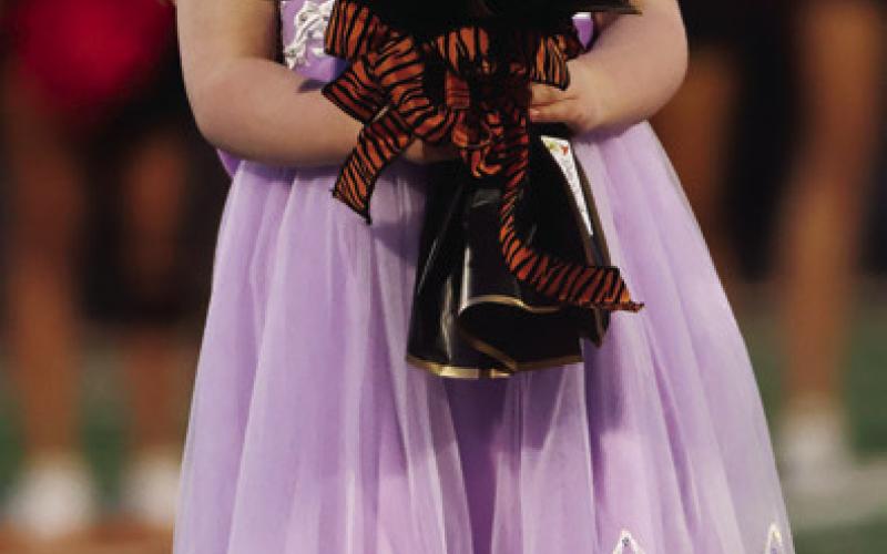 Left: Flower Girl Lyla Beasley walks onto the field.