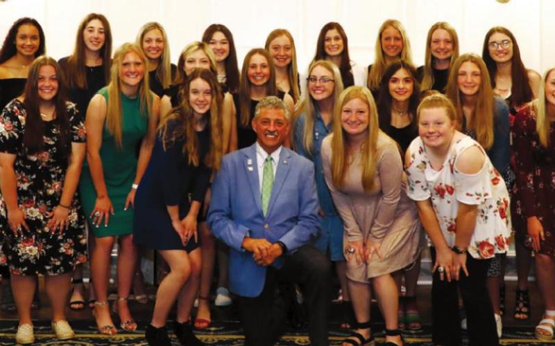Ripley High School girls fastpitch Head Coach Kaleb Hoff man (far left) and Assistant Coach Sheila Wilhelm (far right) and members of the State Champion Ripley High School girls fastpitch softball team were recognized by State Representative John Talley at the Capitol in March.
