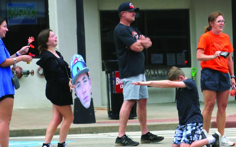 Tiger baseball fans lined Broadway on Thursday afternoon to send the Cushing Tigers off to the state tournament.