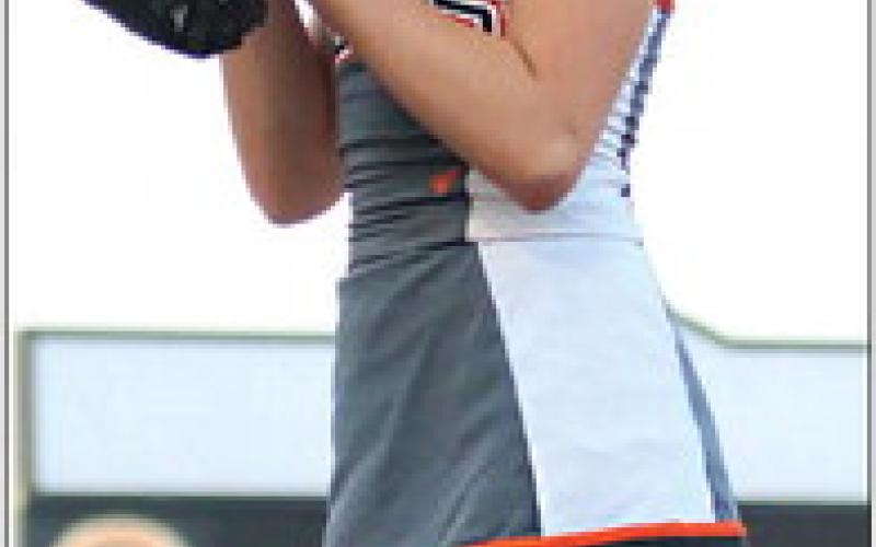 Cushing Tiger Cheerleader Marlee Myers stunts on the sidelines of the Cushing home opener.