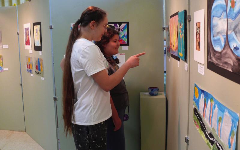 Brooklyn Park and Bonnie Hamm enjoy a painting at the Lachenmeyer Arts Center.