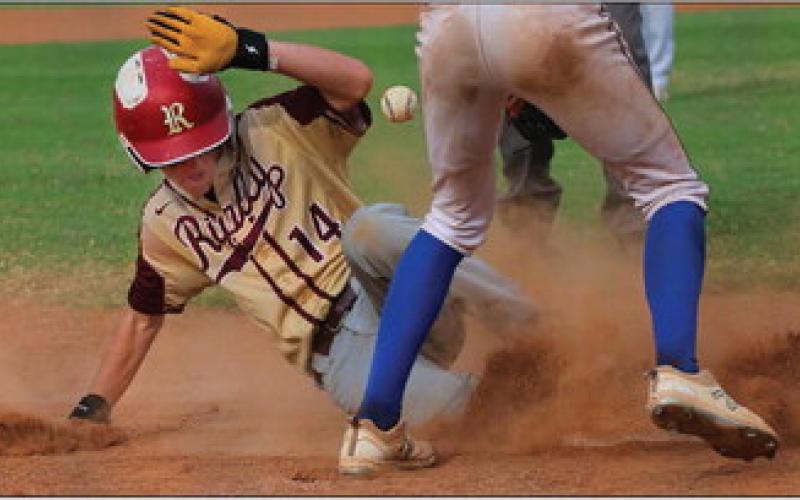 Ripley Warrior Kelton Arther slides into third base at the OSSAA Class-A district tournament game against the Glencoe Panthers. Photos by Allie Prater