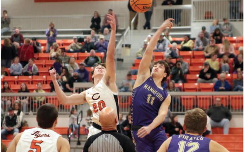 Tiger Lane Yaunt goes for the tip, to start off what proved to be an evenly matched, hard fought contest against Mannford Friday. Photo by Kaleb Tadpole