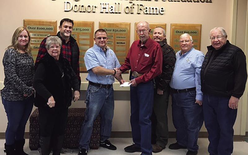 Cushing Masonic Lodge Worshipful Master Sean Martin presents a check for $5,279.70 to Lee Roy Kalka, Cushing Regional Hospital Foundation president. The funds will be used to help pay tuition for Cushing firemen who want to attend Central Tech's paramedic certification program. Pictured (from left) are: Latina Simmons, Pam Hawthorn, Matt Turner, Sean Martin, Lee Roy Kalka, Justin Stewart, Mike Harris and Joe Manning.