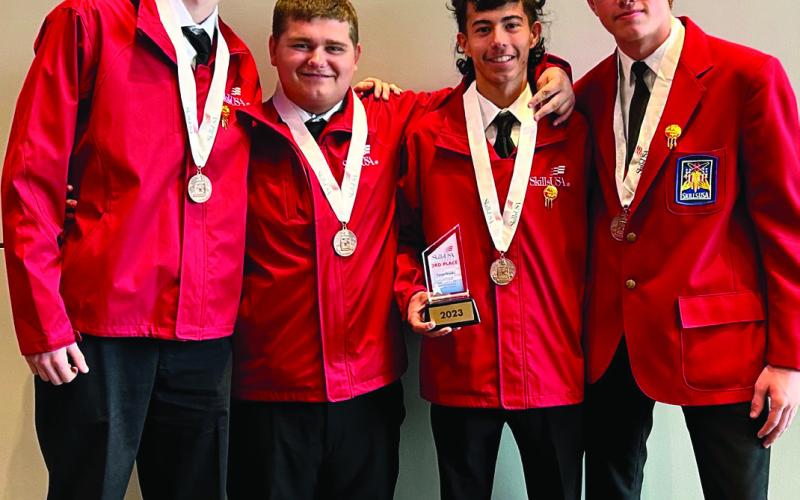 Ty Harelson, Levi Simpson, David Perez, Hayden Scanlon — Ty Harelson (far left) of Davenport High School, Hayden Scanlon (second from left) of Kellyville High School, David Perez (second from right) of Olive High School, and Levi Simpson (far right) of Cushing High School were awarded first place in TeamWorks (Secondary).
