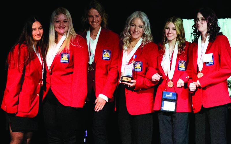 SkillsUSA 3rd place — The SkillsUSA State Leadership Conference awarded Cushing High School’s Amber Fausto (far left), Prue High School’s Ashlyn Toothman (second from left), Ripley High School’s Carolyn Overton (third from left), Kellyville High School’s Rebecca Womble (third from right), Cleveland High School’s Eva Felmlee (second from right), and Kellyville High School’s Madison Gagliardia (far right) with third place in Chapter Business Procedure (Secondary).